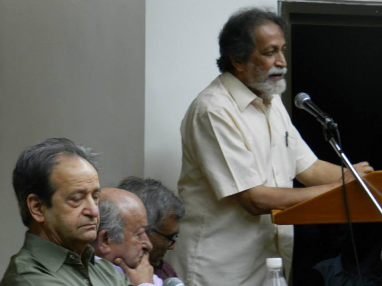 Prabhat Patnaik speaking at the book launch of Marx, Gandhi and Modernity: Essays presented to Javeed Alam (edited by Akeel Bilgrami), Delhi, July 2014; (seated, left to right) Aijaz Ahmad, Javeed Alam and Gopal Guru