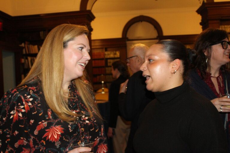 a photo of two women facing each other