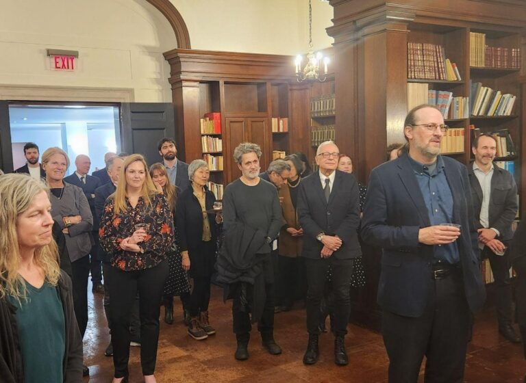 a photo of a group of people in a library
