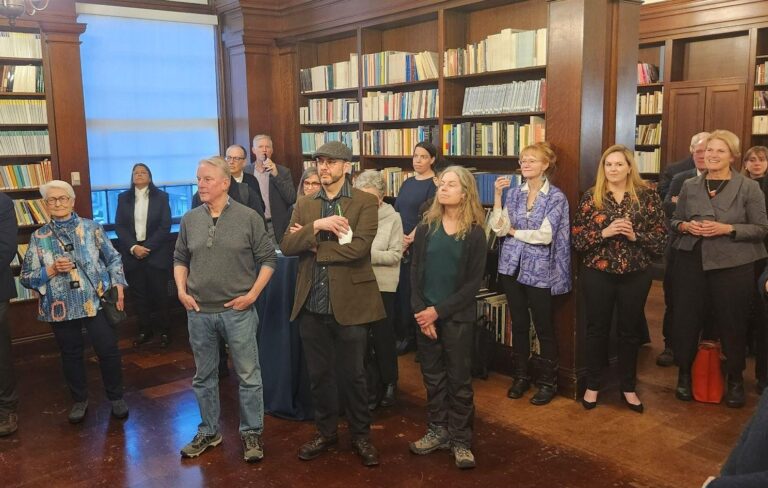 a photo of a group of people in a library